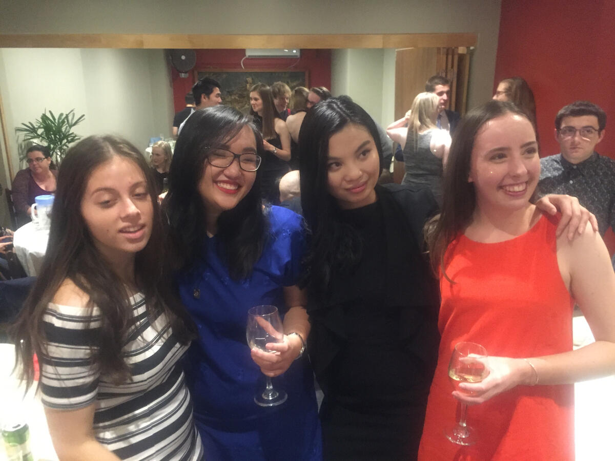 Seventeen-year-old Lenny Cheng with fellow delegates at the UN Youth Australia Summit in Brisbane; third from the right, holding a wine glass.