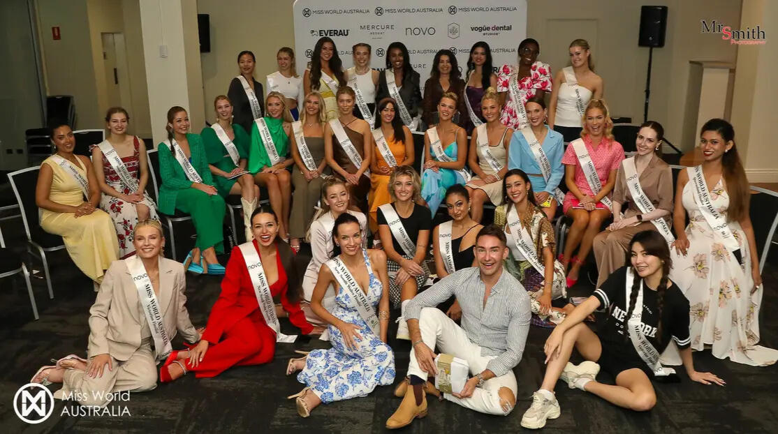 Group of Miss World Australia contestants posing at a state-level event, with Leonor Cheng (Lenny Cheng) seated front-right in black.